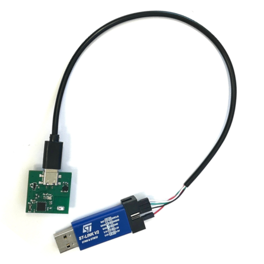 The board with the USB-C cable plugged in, connected to the ST-Link